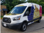 Light commercial van with blue and yellow design