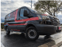 Black and red van showcasing automotive tire and exterior design.