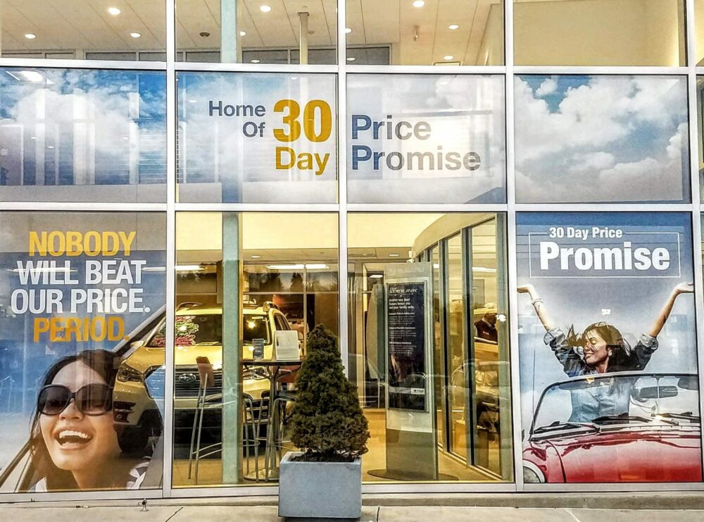 Glass building windows showcasing an advertising logo