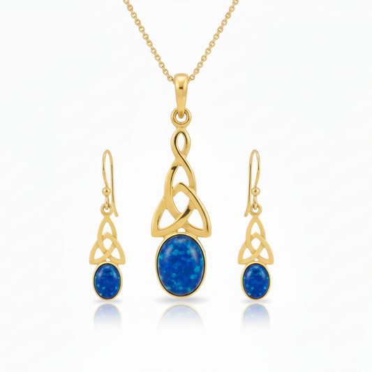 9ct gold Celtic memorial jewellery set with deep blue iridescent opal – pendant 10x8mm and earrings 7x5mm flat-lay white background