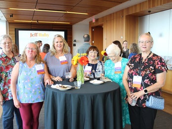Women standing together at a donor event