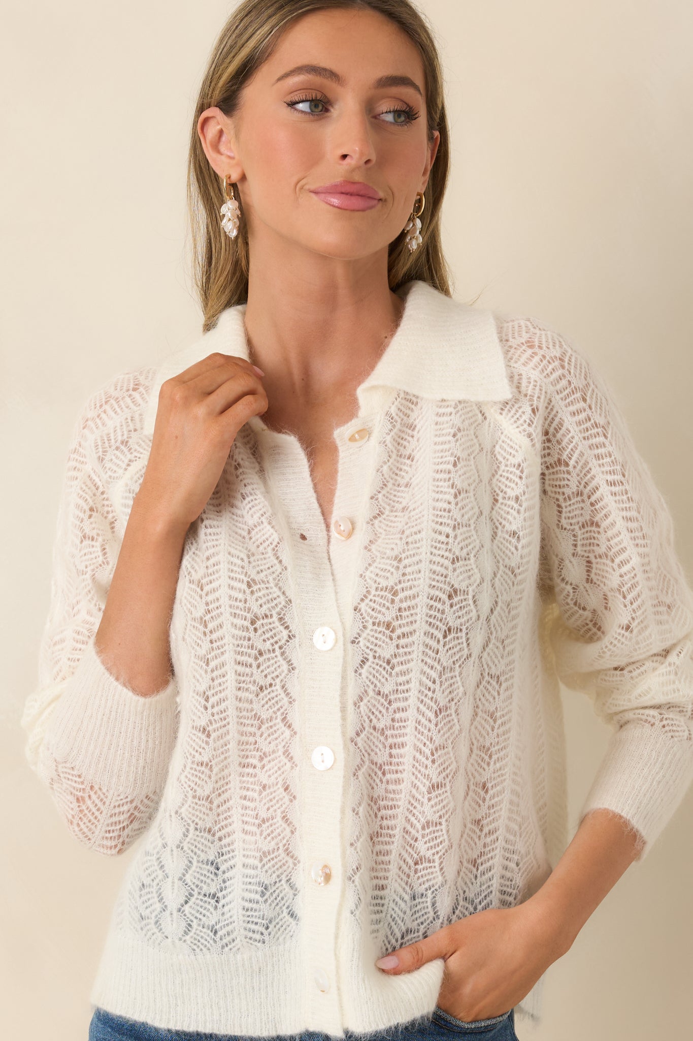 Cardigan highlighting openwork chevron pattern and lightweight knit feel.