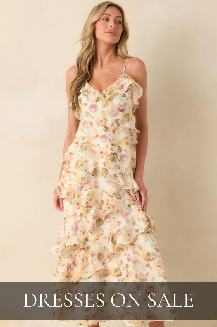 Model wearing a soft floral ruffle midi dress with cascading layers featured in the Red Dress Dresses on Sale collection.